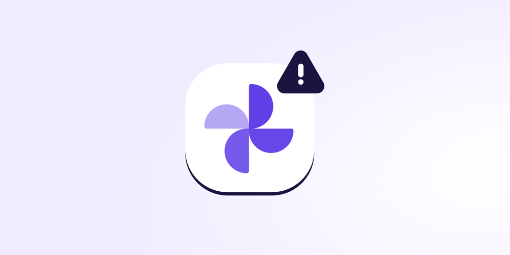 A stylized icon resembling the Google Photos logo with a dark triangular warning sign containing an exclamation mark, representing Google Photos safety issues